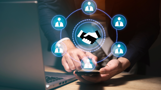 man on phone with hand shake graphic