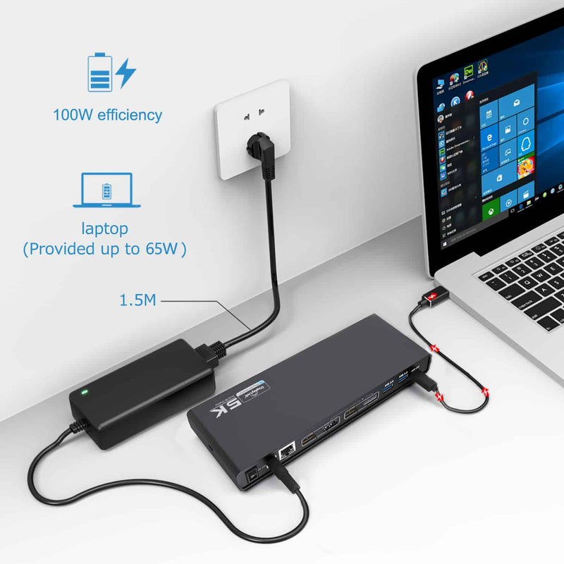 Load image into Gallery viewer, Image of the docking station attached to a laptop charging it while connected to the wall outlet. Image: The docking station offers 100W power effciency and up to 65W to the laptop