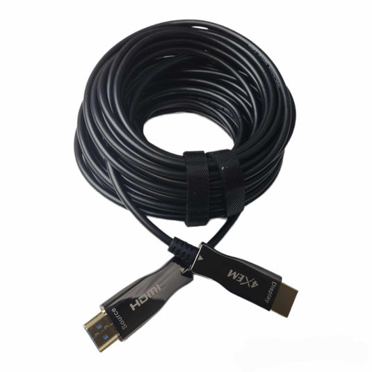 Fiber hdmi cable coiled onto it self against a white background